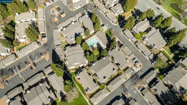 an aerial view of a residential apartment building with yard