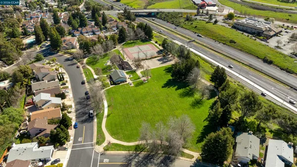 an aerial view of a residential houses with outdoor space