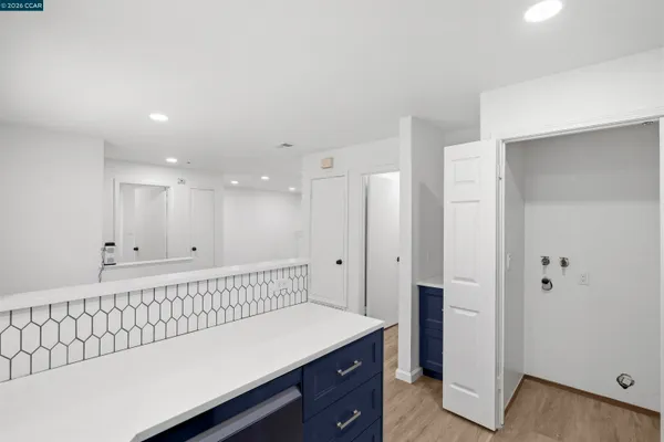 a spacious bathroom with a tub and a sink