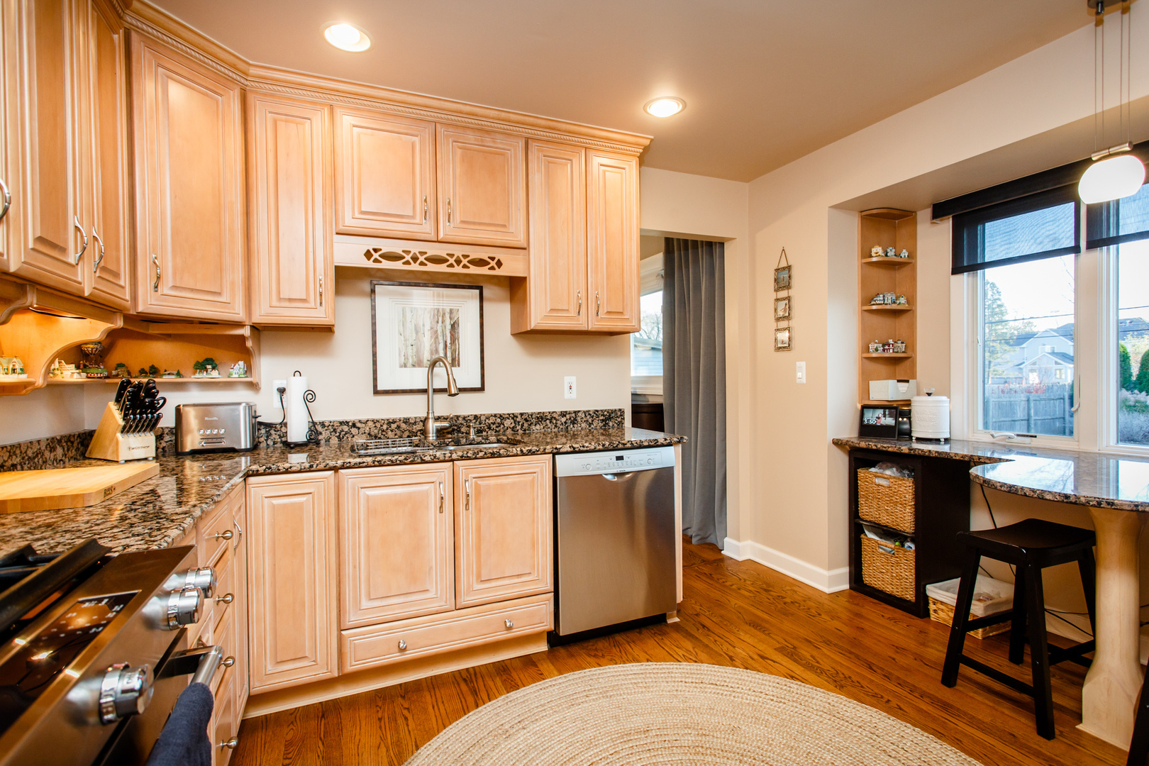 25 Mulberry Road Deerfield, IL 60015 - Photo 17 of 63 a kitchen with stainless steel appliances granite countertop a stove a sink and a refrigerator