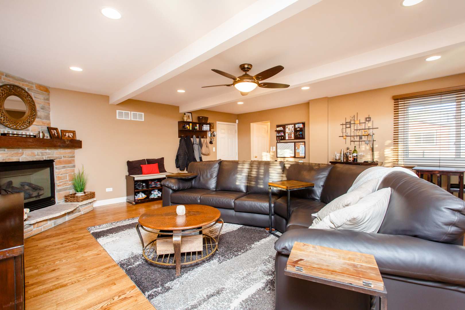 25 Mulberry Road Deerfield, IL 60015 - Photo 25 of 63 a living room with furniture a fireplace and a flat screen tv