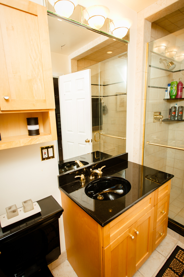 25 Mulberry Road Deerfield, IL 60015 - Photo 41 of 63 a kitchen with a stove and a sink
