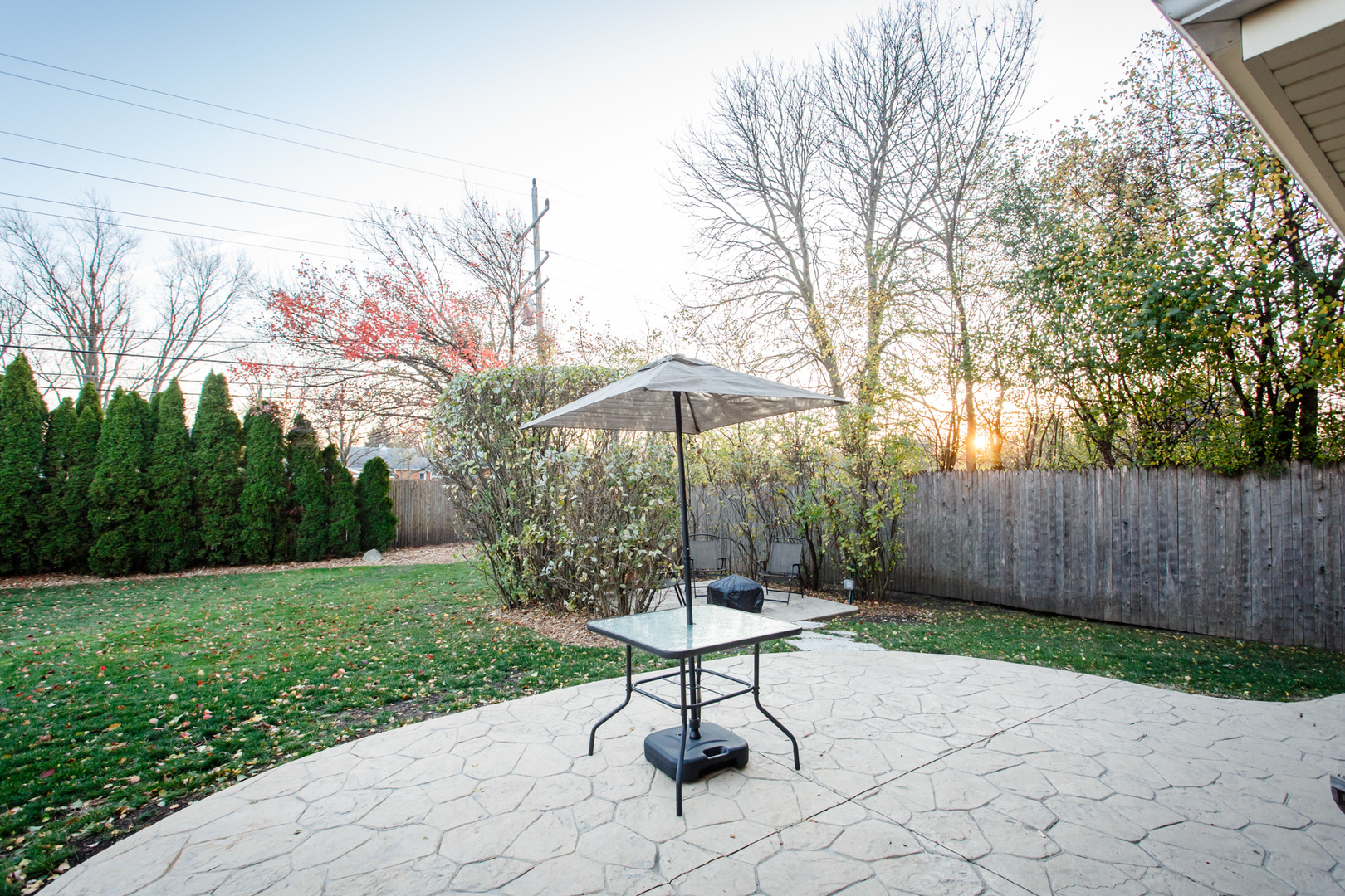 25 Mulberry Road Deerfield, IL 60015 - Photo 55 of 63 a chair and table in backyard of the house