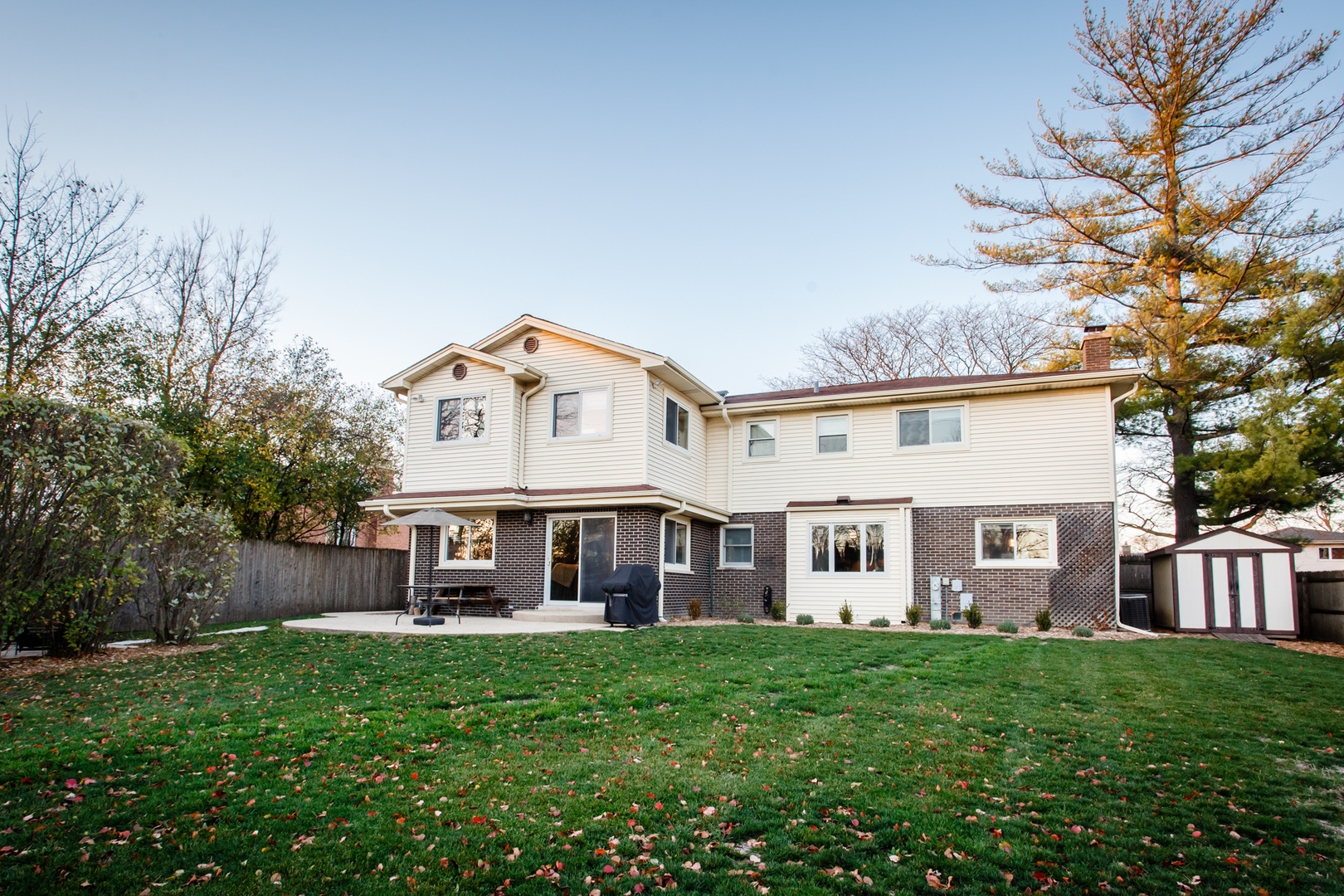 25 Mulberry Road Deerfield, IL 60015 - Photo 57 of 63 a view of a white house with a big yard and large trees