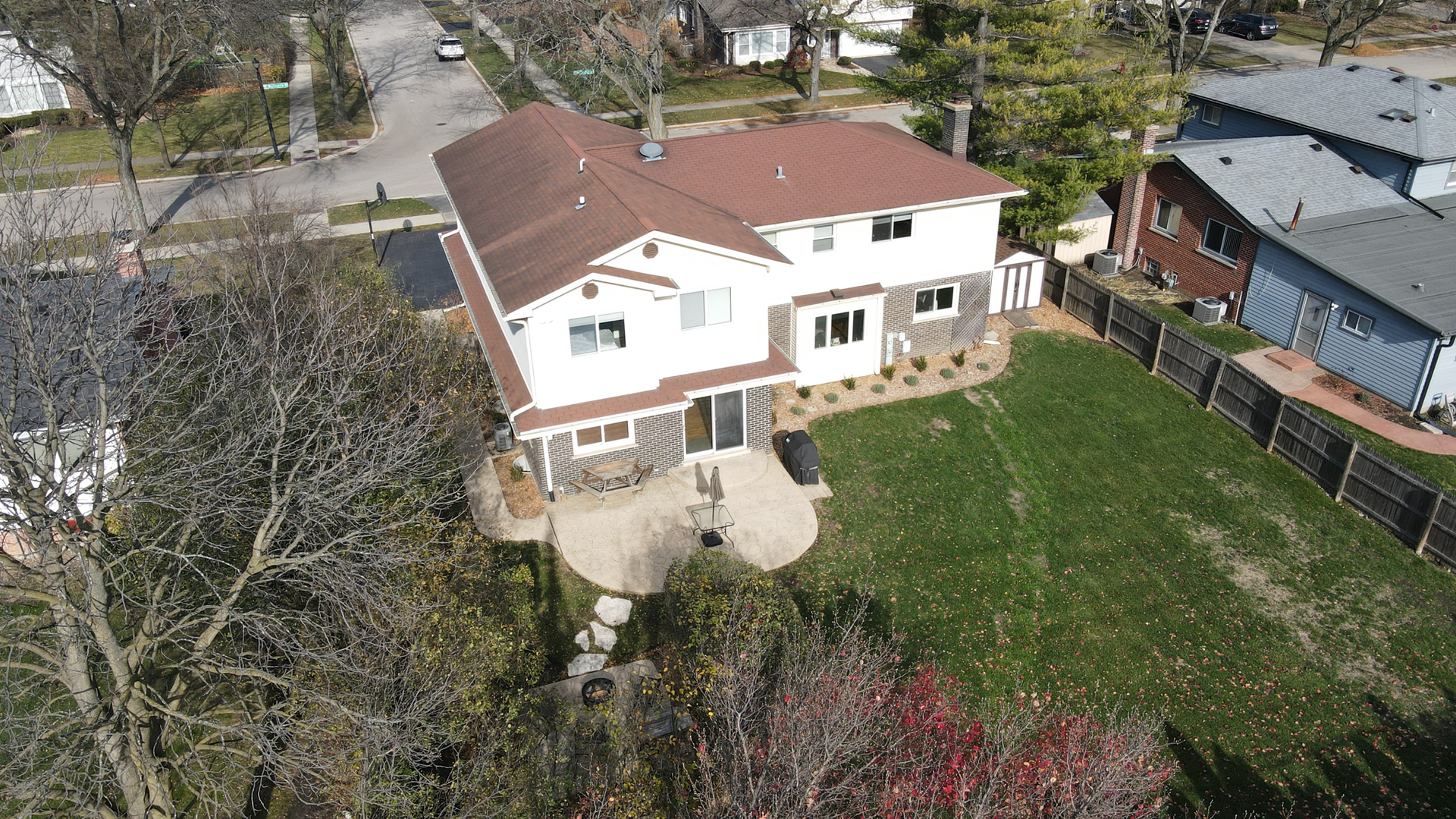 25 Mulberry Road Deerfield, IL 60015 - Photo 61 of 63 an aerial view of a house with table and chairs and a yard