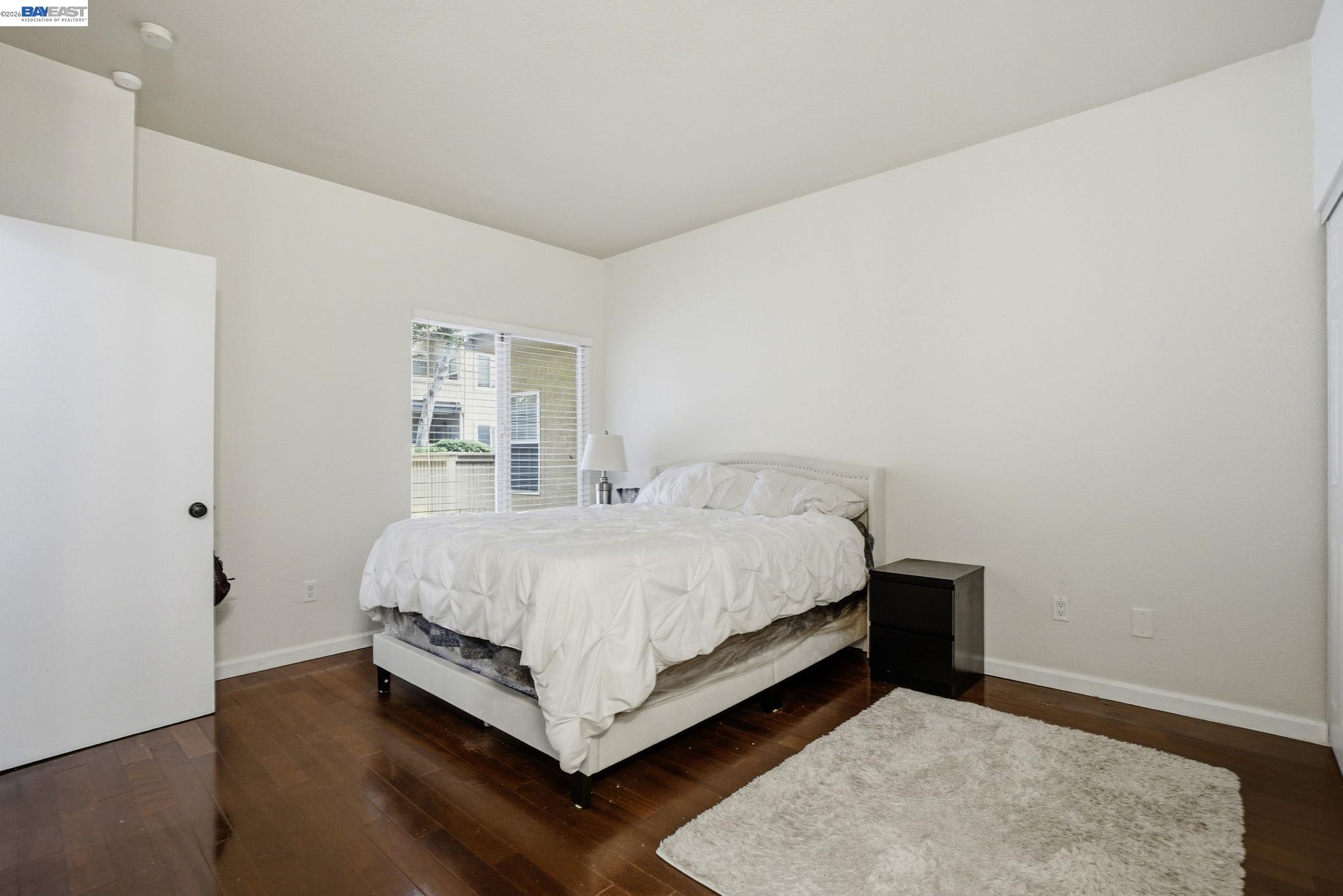 1405 Forest Run Hercules, CA 94547 - Photo 14 of 26 a bed room with a bed and a night stand
