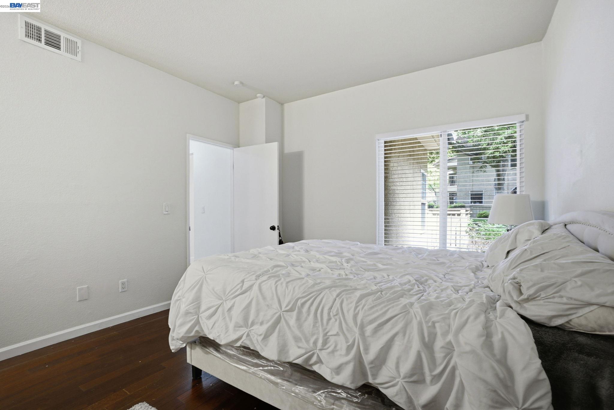 1405 Forest Run Hercules, CA 94547 - Photo 16 of 26 a bed sitting in a bedroom next to a window