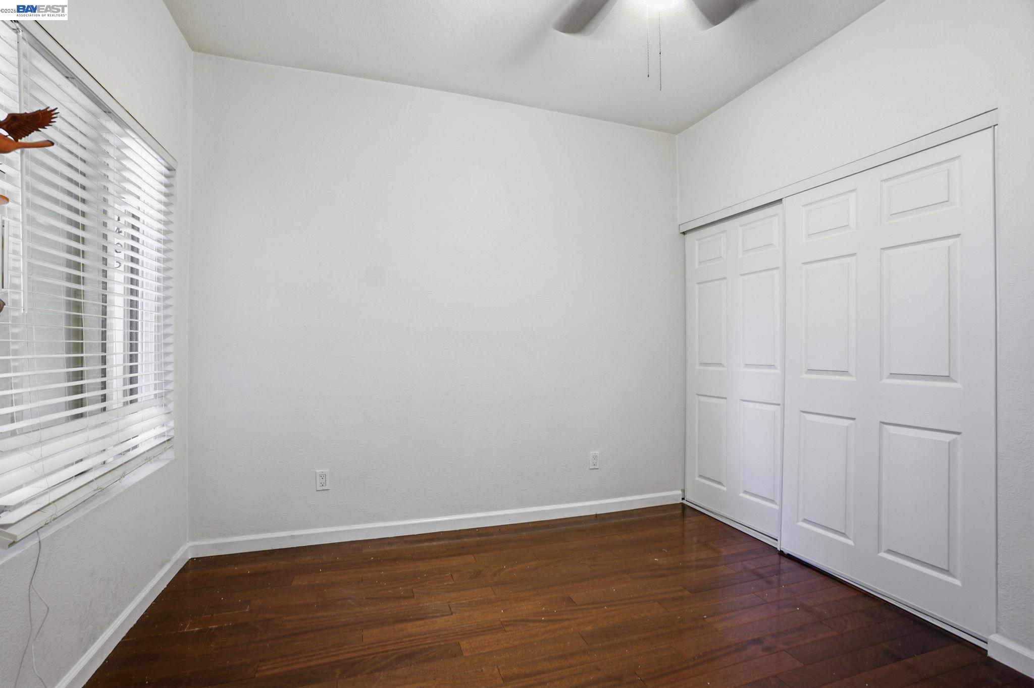 1405 Forest Run Hercules, CA 94547 - Photo 18 of 26 wooden floor in an empty room with a window