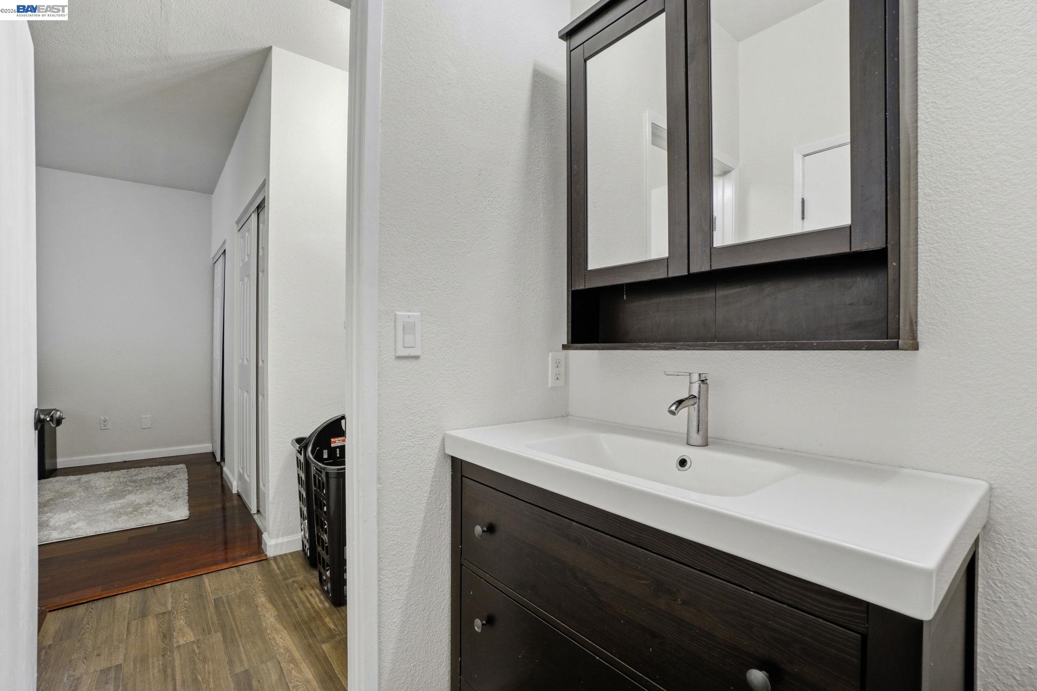 1405 Forest Run Hercules, CA 94547 - Photo 23 of 26 a bathroom with a sink and a mirror