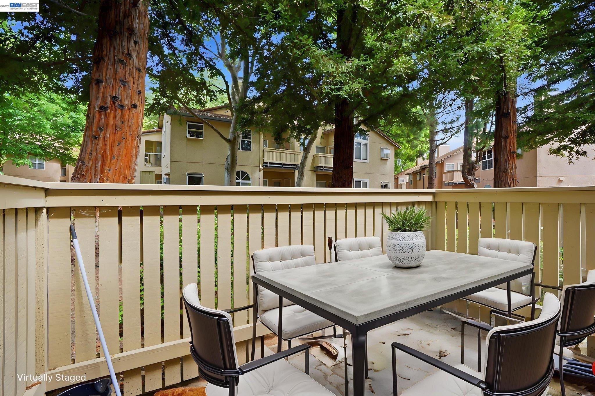 1405 Forest Run Hercules, CA 94547 - Photo 25 of 26 a view of a patio with table and chairs and wooden fence