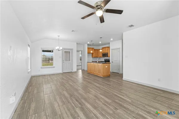 a view of a hardwood floor in a room