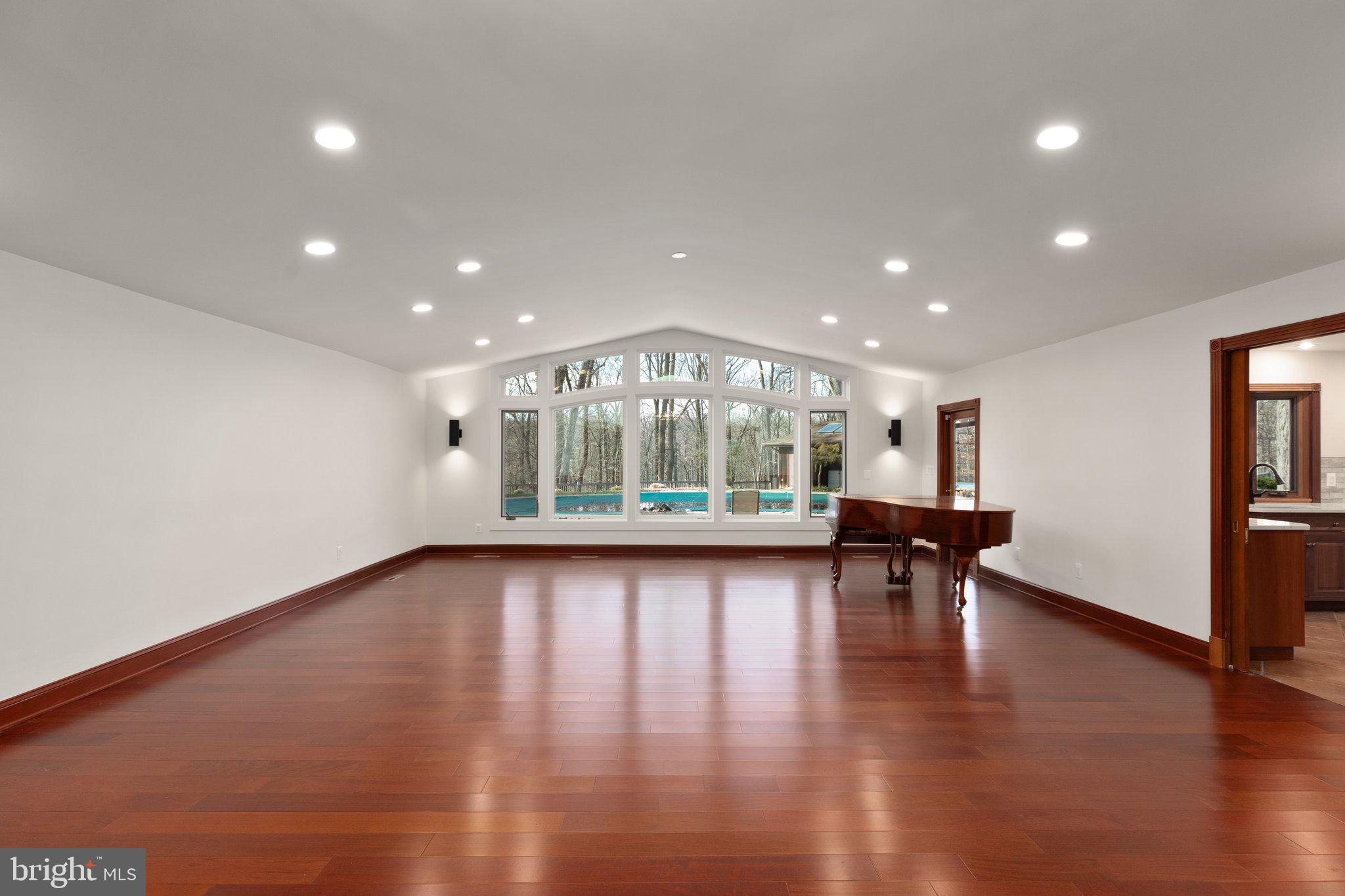 10810 Baronet Road Owings Mills, MD 21117 - Photo 26 of 83 an empty room with wooden floor and outdoor seating