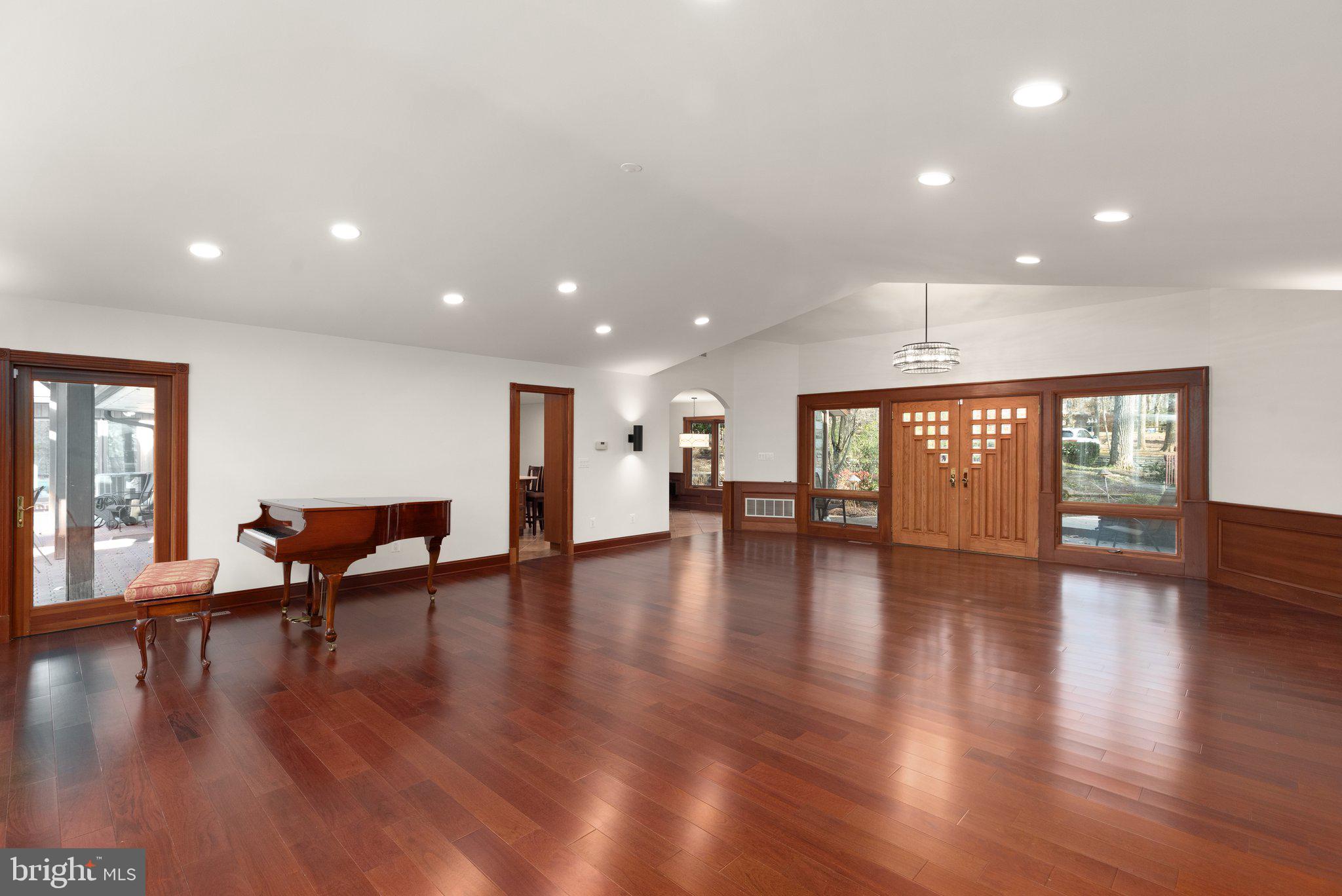 10810 Baronet Road Owings Mills, MD 21117 - Photo 27 of 83 a view of an empty room with wooden floor and a glass door