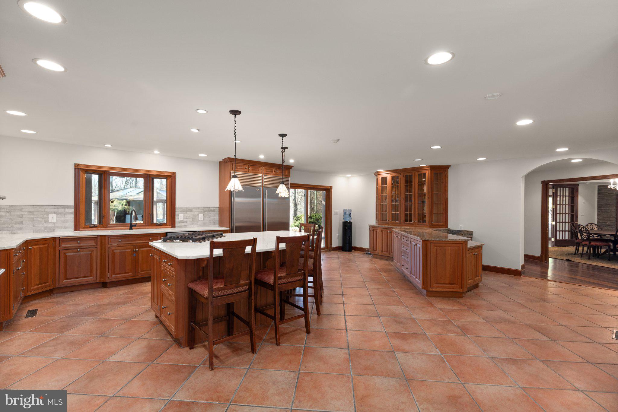 10810 Baronet Road Owings Mills, MD 21117 - Photo 29 of 83 a kitchen with a dining table chairs and view kitchen