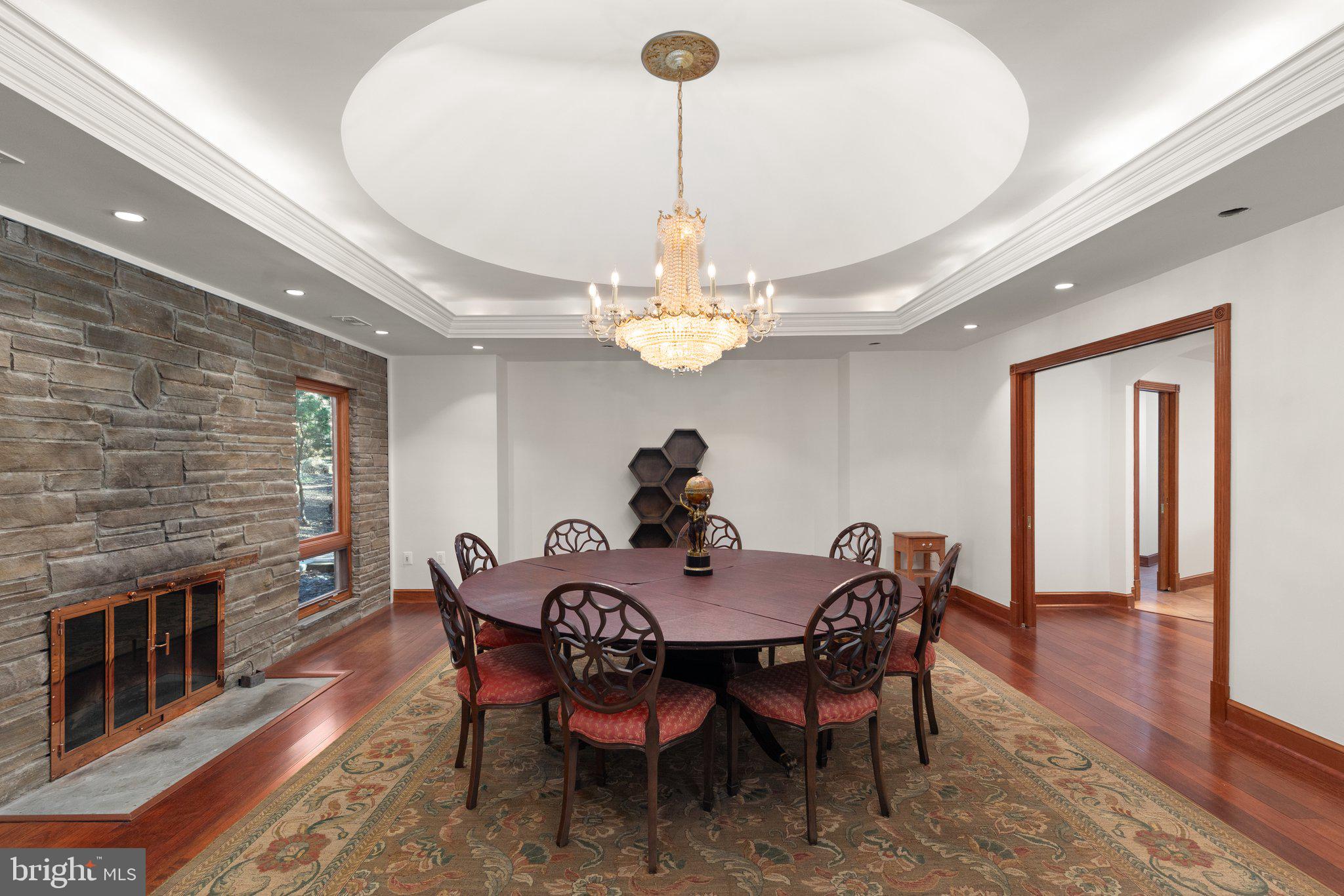 10810 Baronet Road Owings Mills, MD 21117 - Photo 36 of 83 a dining room with furniture a chandelier and wooden floor