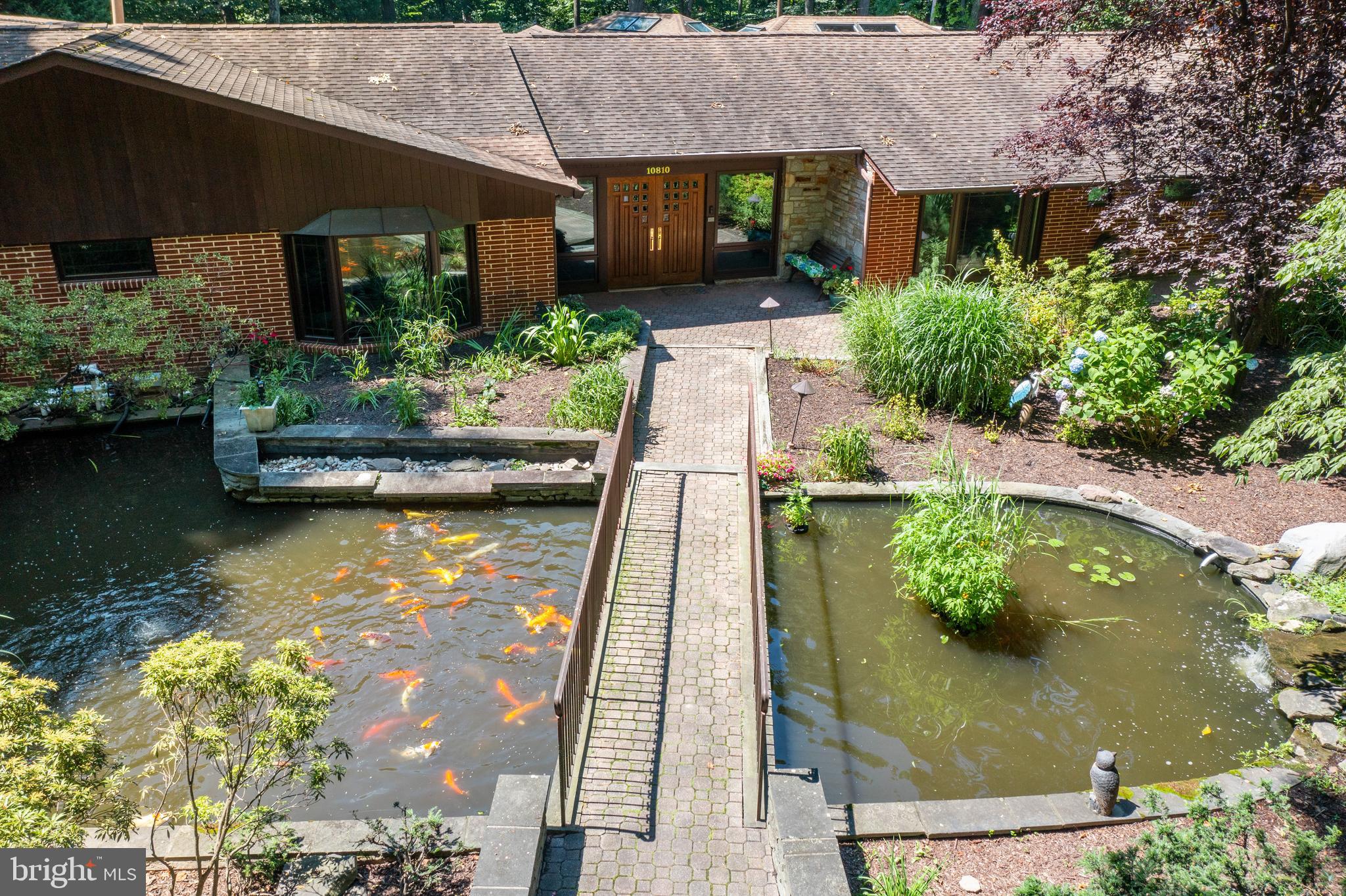 10810 Baronet Road Owings Mills, MD 21117 - Photo 4 of 83 an aerial view of a house with swimming pool and outdoor seating