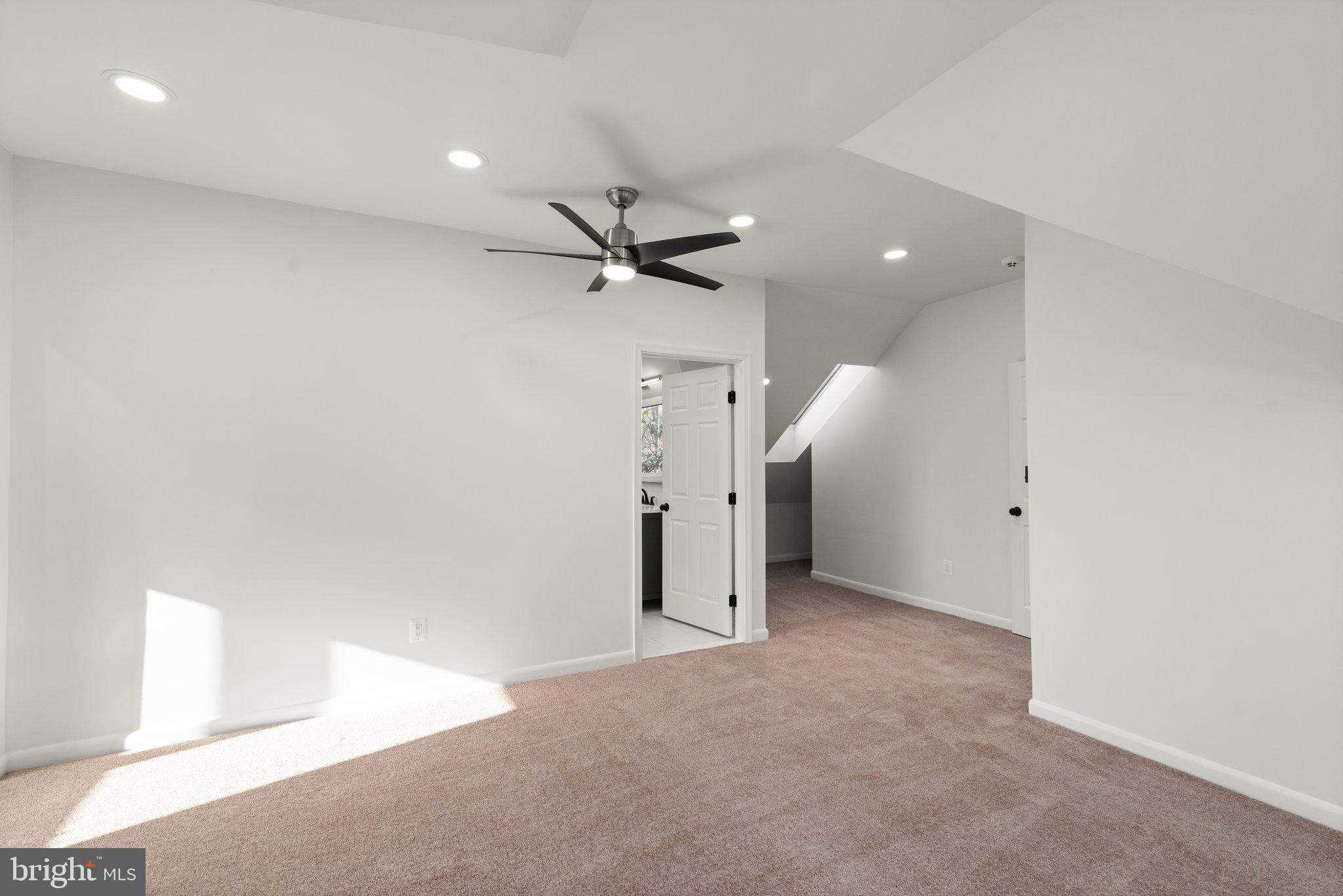 10810 Baronet Road Owings Mills, MD 21117 - Photo 50 of 83 an empty room with a ceiling fan and a window