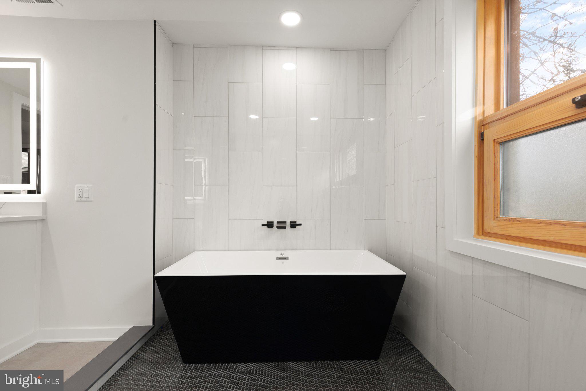 10810 Baronet Road Owings Mills, MD 21117 - Photo 69 of 83 a room with a sink and a mirror