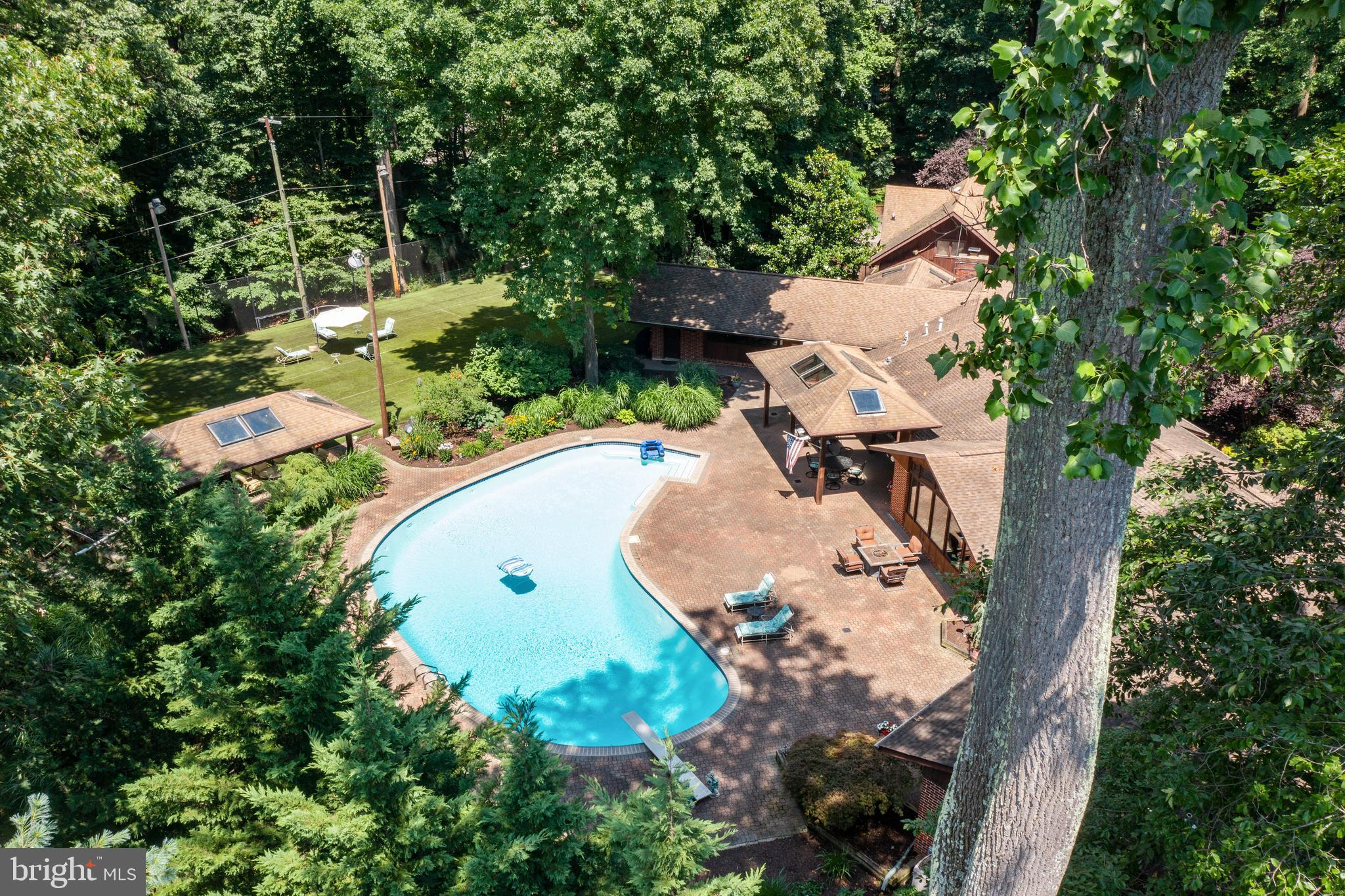 10810 Baronet Road Owings Mills, MD 21117 - Photo 7 of 83 an aerial view of a house with a yard and trees