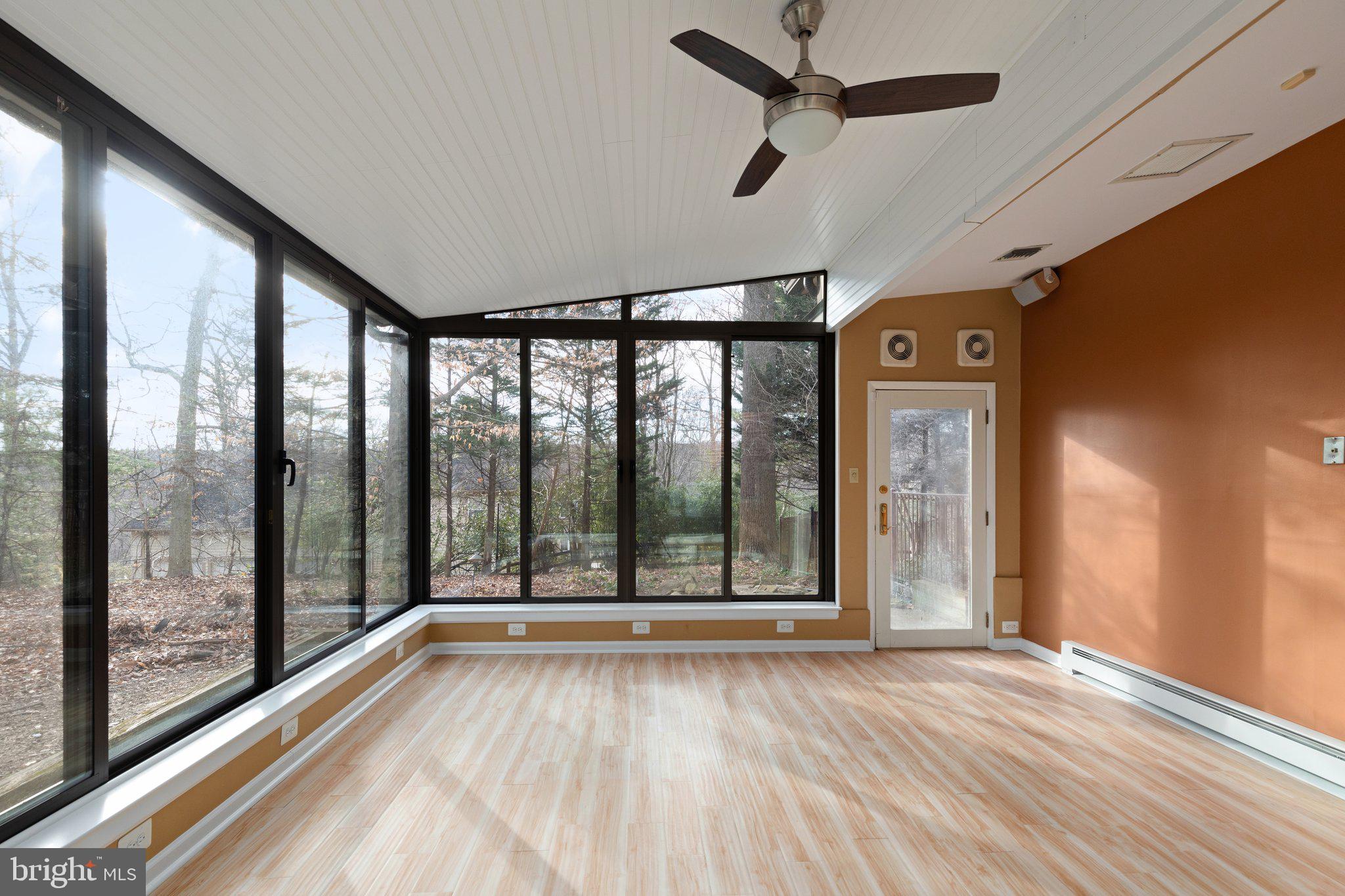 10810 Baronet Road Owings Mills, MD 21117 - Photo 75 of 83 a view of an empty room with wooden floor and a window