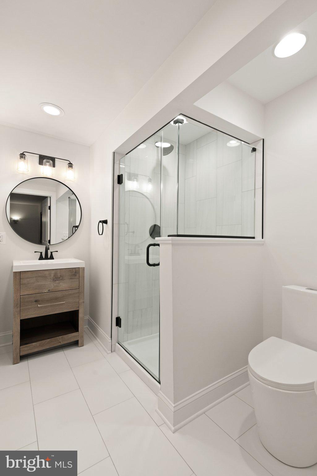 10810 Baronet Road Owings Mills, MD 21117 - Photo 76 of 83 a bathroom with a toilet a sink and shower