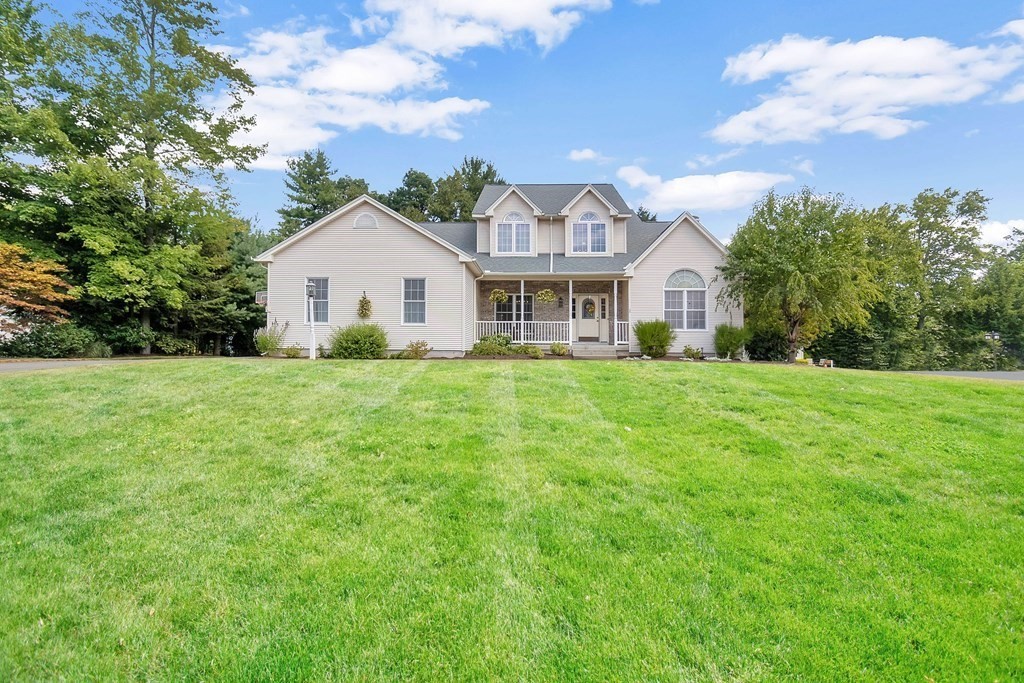 46 Radisson Lane Westfield, MA 01085 - Photo 1 of 40 a view of a house next to a big yard and large trees