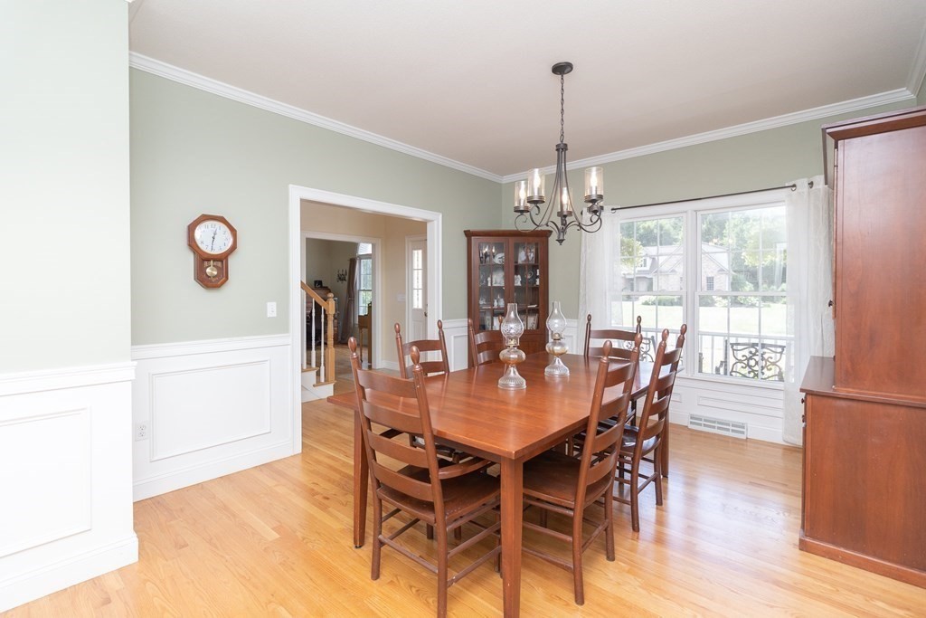 46 Radisson Lane Westfield, MA 01085 - Photo 13 of 40 a view of a dining room with furniture window and wooden floor