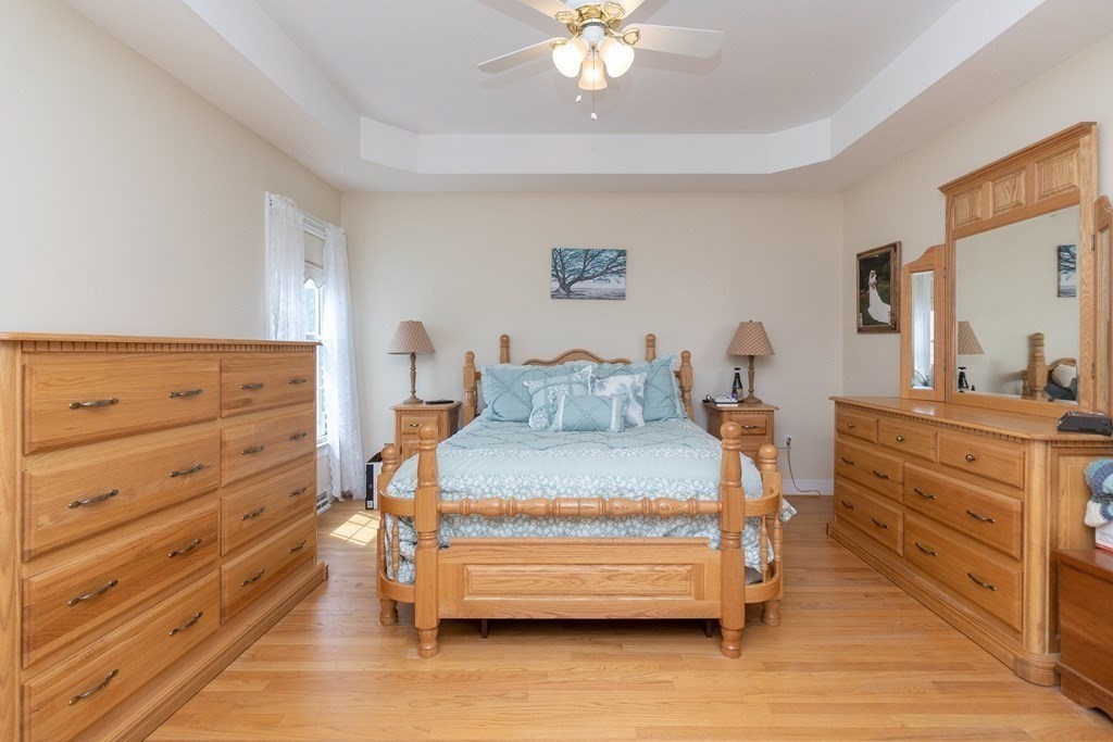 46 Radisson Lane Westfield, MA 01085 - Photo 19 of 40 a bedroom with a bed and a dresser
