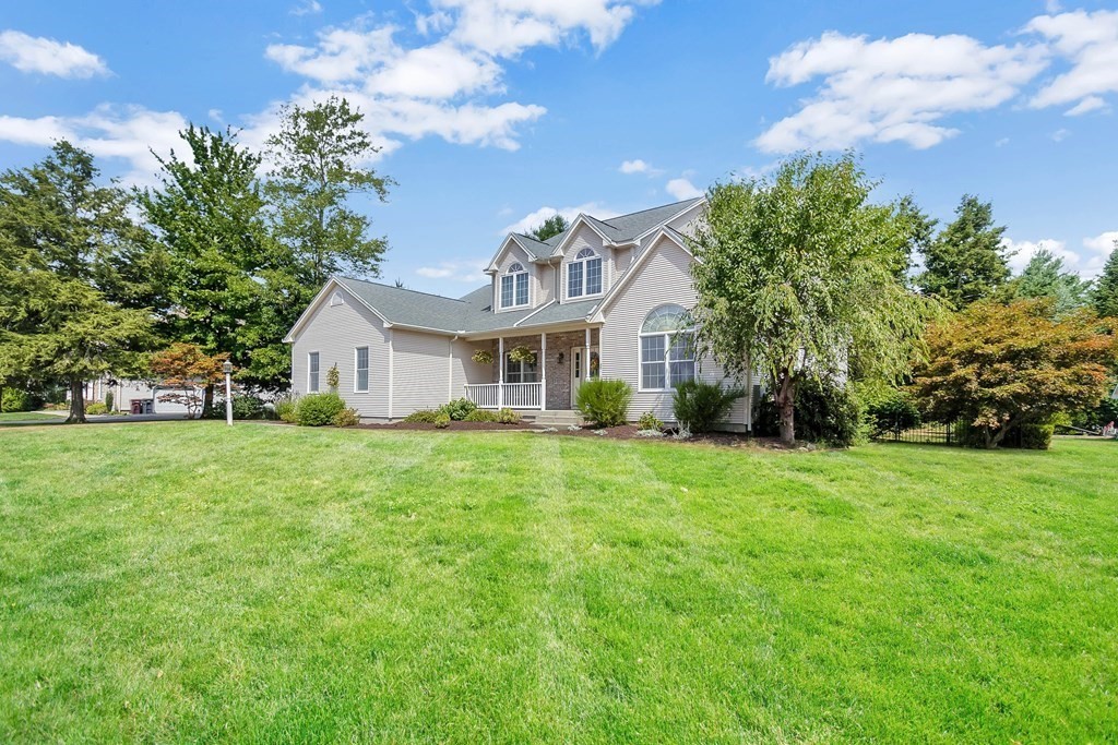 46 Radisson Lane Westfield, MA 01085 - Photo 2 of 40 a front view of a house with a garden