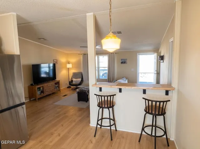 a view of a kitchen from a dining room