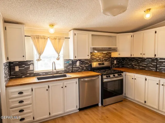 a bathroom with a toilet sink and tub