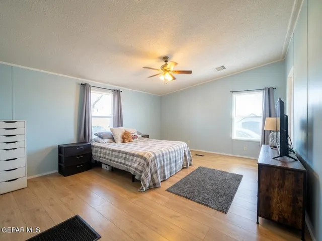 a bedroom with a bed and a table