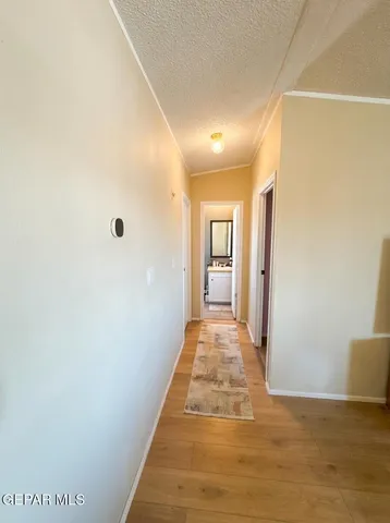 a bathroom with a granite countertop sink toilet and mirror