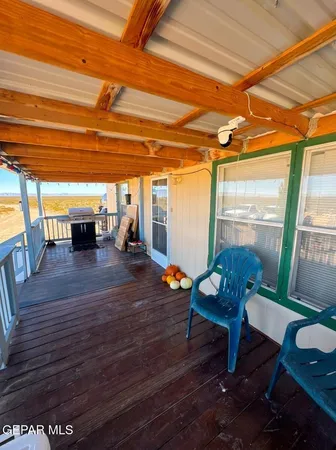 a view of a porch with furniture