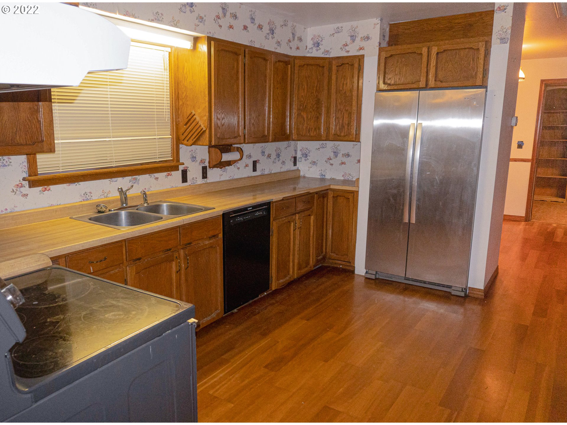 377 North Side Road Sutherlin, OR 97479 - Photo 8 of 20 a kitchen with stainless steel appliances granite countertop a sink and a refrigerator