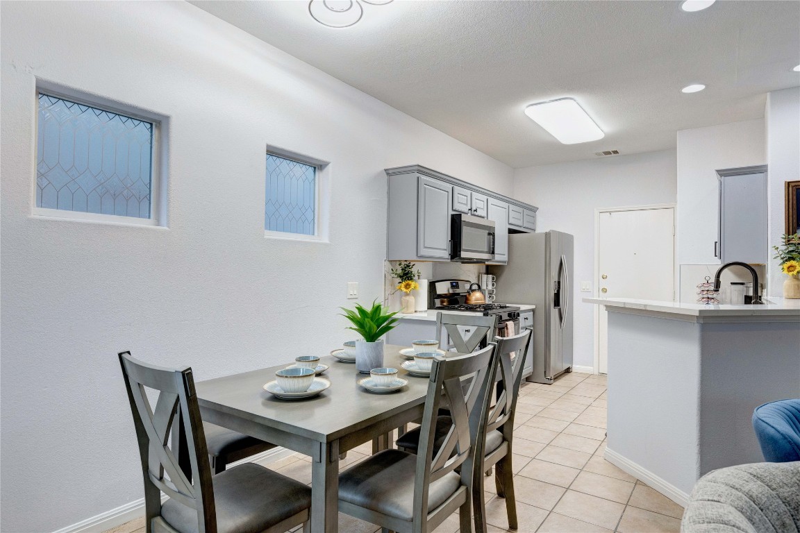 7510 Lazy Creek Drive, Unit B Austin, TX 78724 - Photo 12 of 36 a view of a dining room with furniture