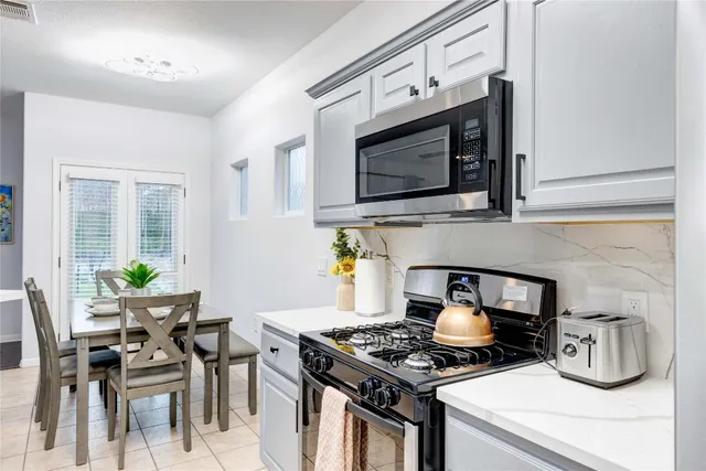 a kitchen with a stove and a microwave