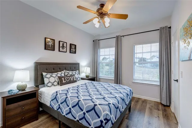 a bedroom with a large bed and a window