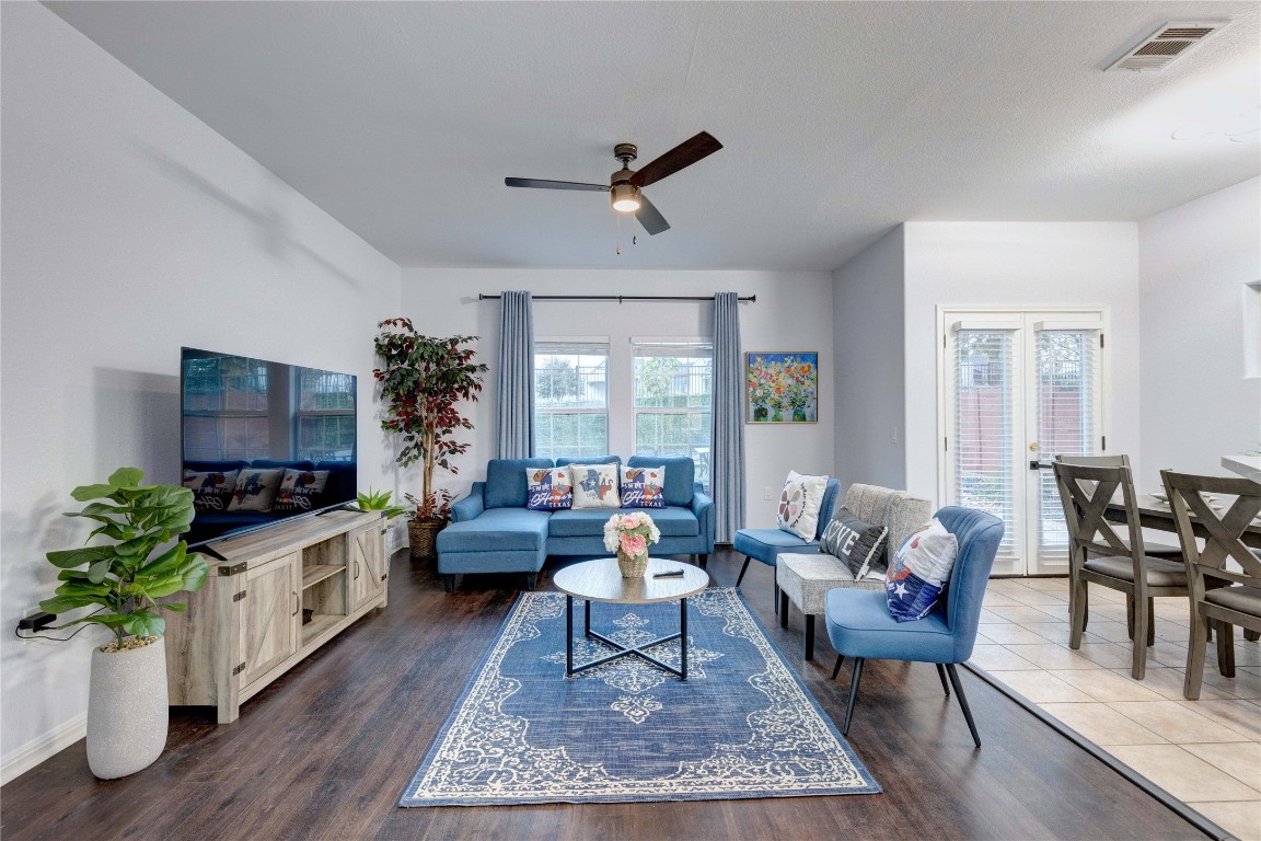 7510 Lazy Creek Drive, Unit B Austin, TX 78724 - Photo 2 of 36 a living room with furniture a rug potted plant and a window