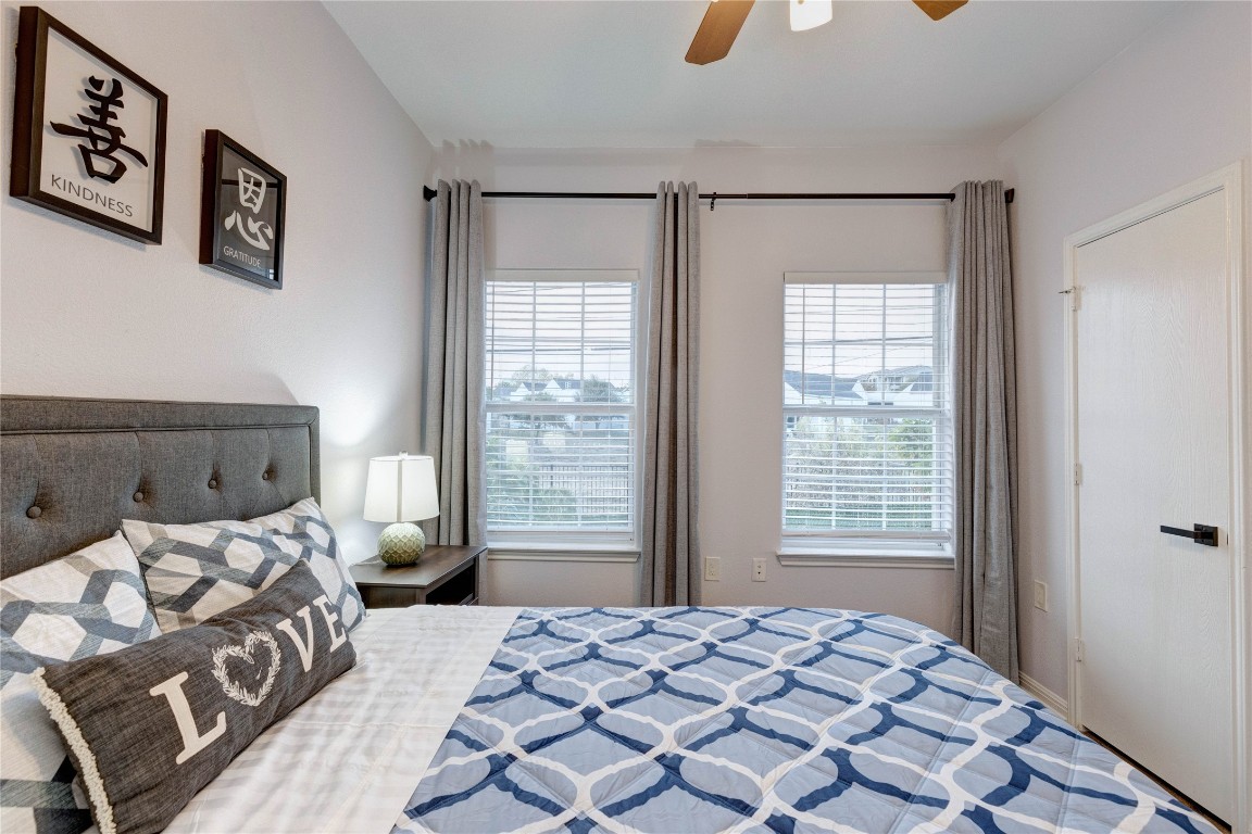 7510 Lazy Creek Drive, Unit B Austin, TX 78724 - Photo 21 of 36 a bedroom with a bed and a window