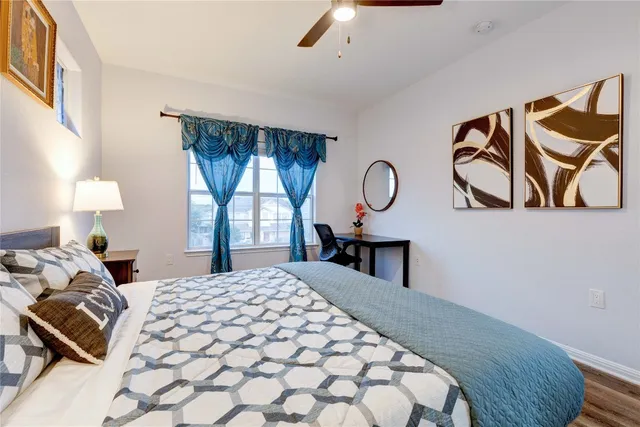 a bedroom with a bed and window