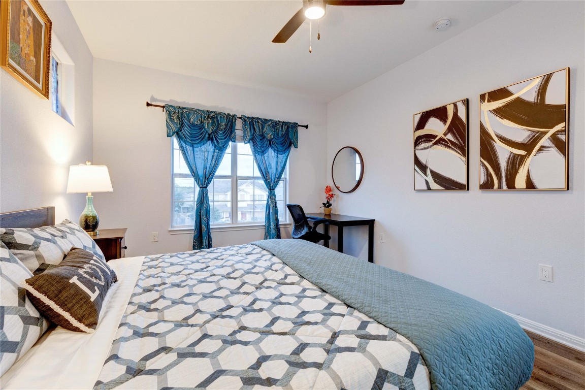 7510 Lazy Creek Drive, Unit B Austin, TX 78724 - Photo 29 of 36 a bedroom with a bed and window