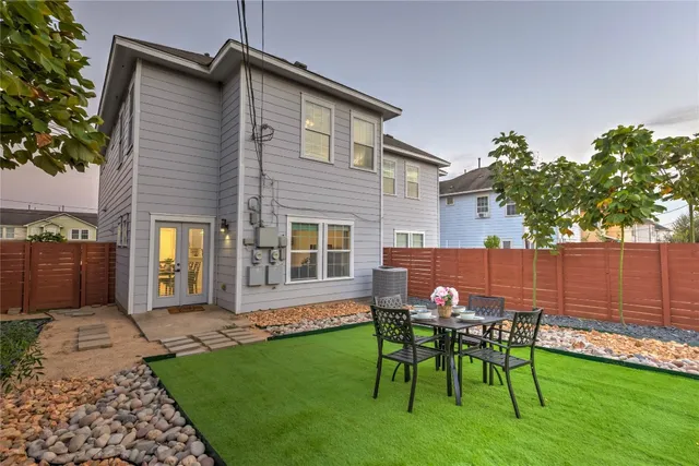 a patio with table and chairs