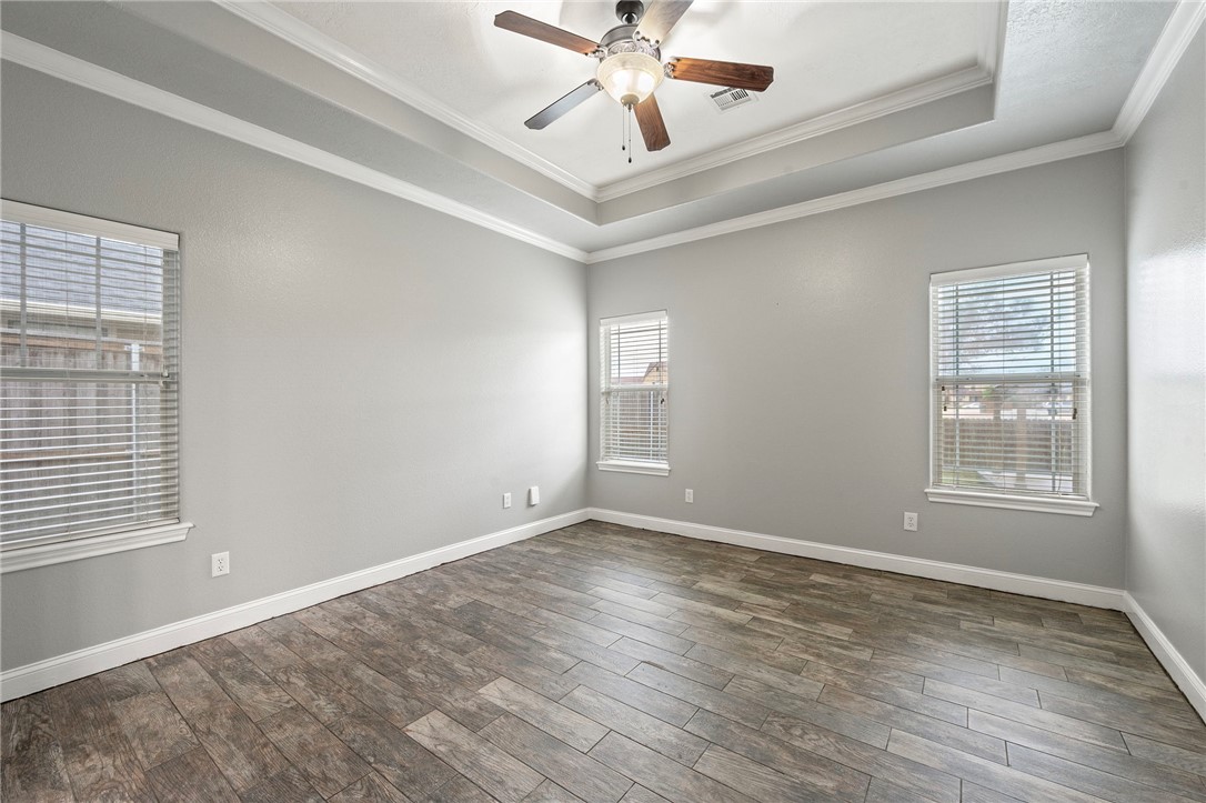 3304 Keefer Loop College Station, TX 77845 - Photo 9 of 21 a view of an empty room with wooden floor and a window