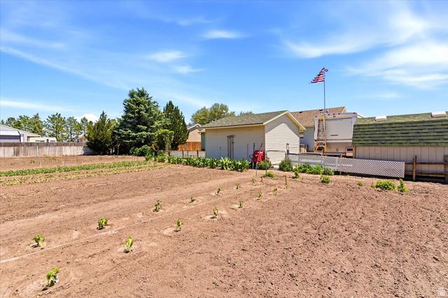 72 Canal Bank Road Garland, UT 84312 - Photo 32 of 40 Cultivated backyard garden area featuring tilled soil and young plants