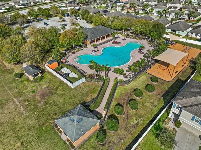 a view of a swimming pool with a lake view