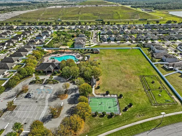 an aerial view of a house with a swimming pool