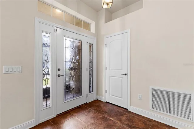 a view of an entryway with wooden floor