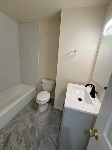 a bathroom with a sink a toilet and a bathtub