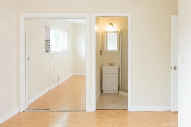 a view of a bathroom from a hallway